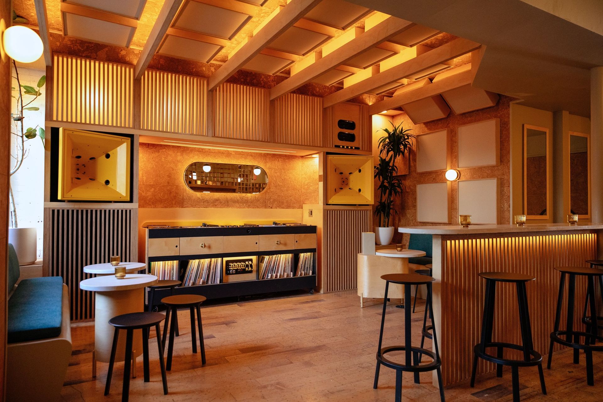 A warm, wood-lined listening room with intimate seating.